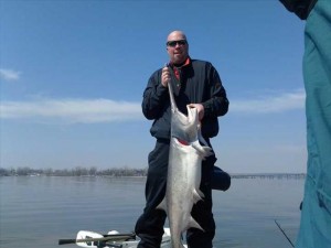 Jim's Guide Service client catches spoonbill on Grand Lake with .